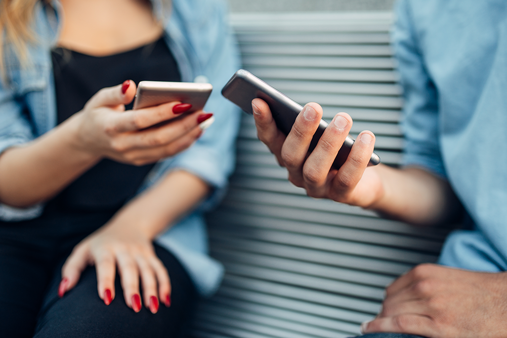 couple browsing their phones